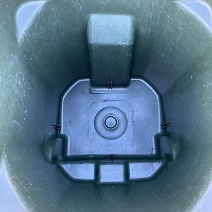 Same green bin after the 200-degree wash — spotless